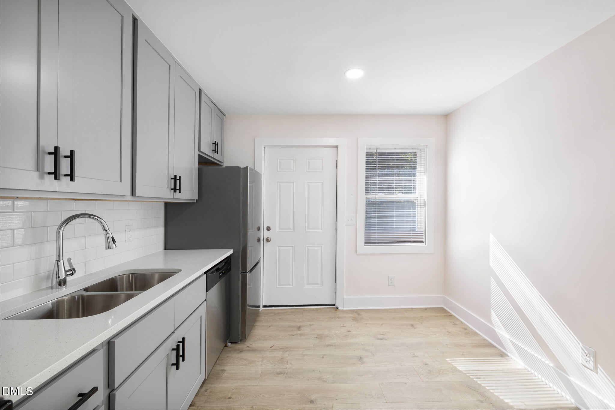 512 East Branch Street Spring Hope, NC 27882 - Photo 12 of 30 a kitchen with a sink a refrigerator and cabinets