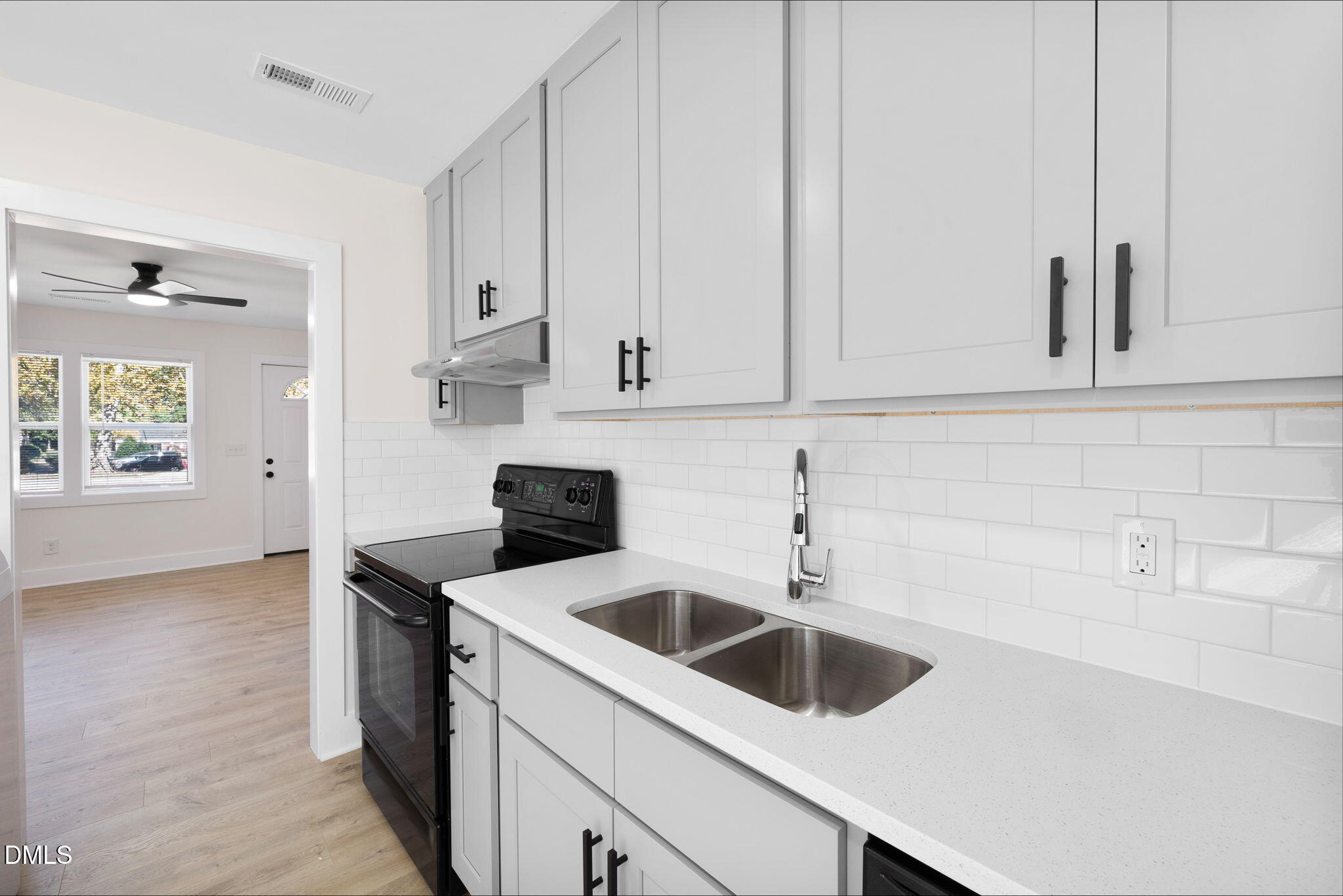 512 East Branch Street Spring Hope, NC 27882 - Photo 14 of 30 a kitchen with white cabinets and white appliances