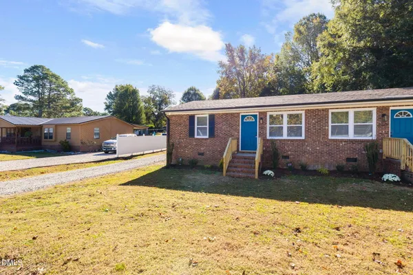 a view of front door of house with stairs