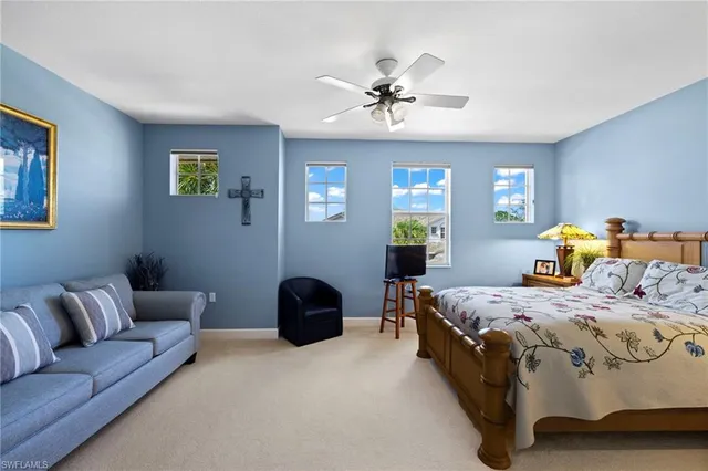 a bedroom with a bed and couch