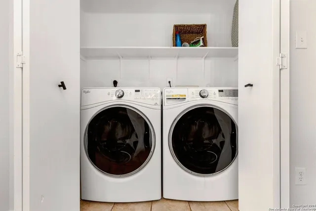 a view of a hallway with washer and dryer