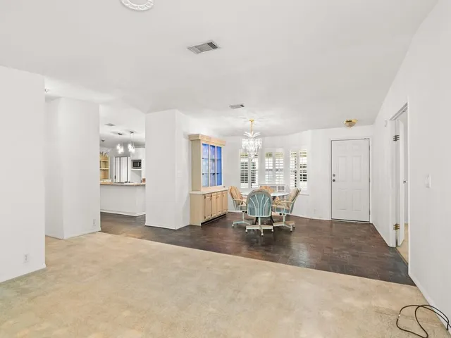a view of a livingroom with a dinning table and chair