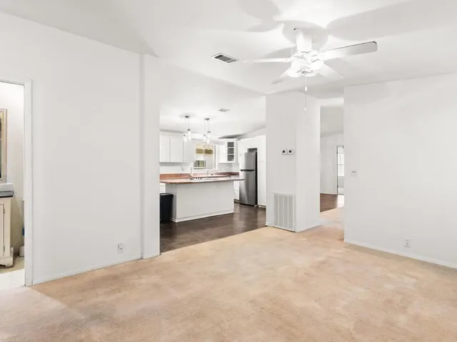 a view of a kitchen with empty room