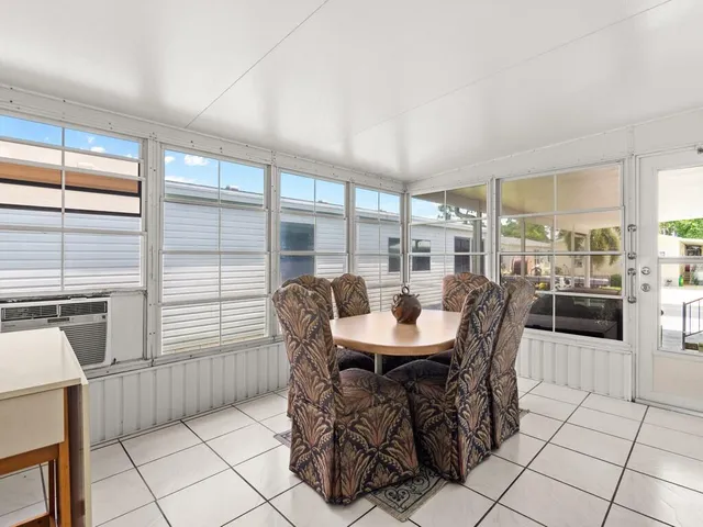 a view of a dining room and livingroom with furniture