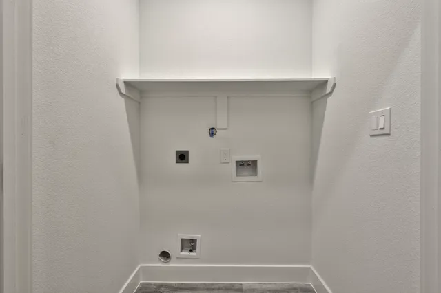 a view of a kitchen with a sink and wooden floor