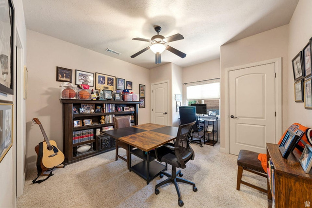 1609 East 10 S Street St. George, UT 84790 - Photo 40 of 68 Flexible-use room featuring neutral-toned walls, carpet flooring, a ceiling fan with integrated lighting, and white interior doors