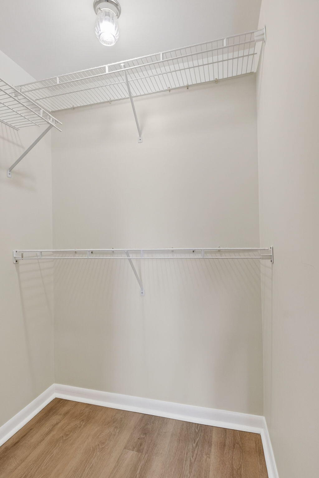 2840 Southwest 13th Street, Unit 103 Delray Beach, FL 33445 - Photo 29 of 72 a view of a room with racks on the wall