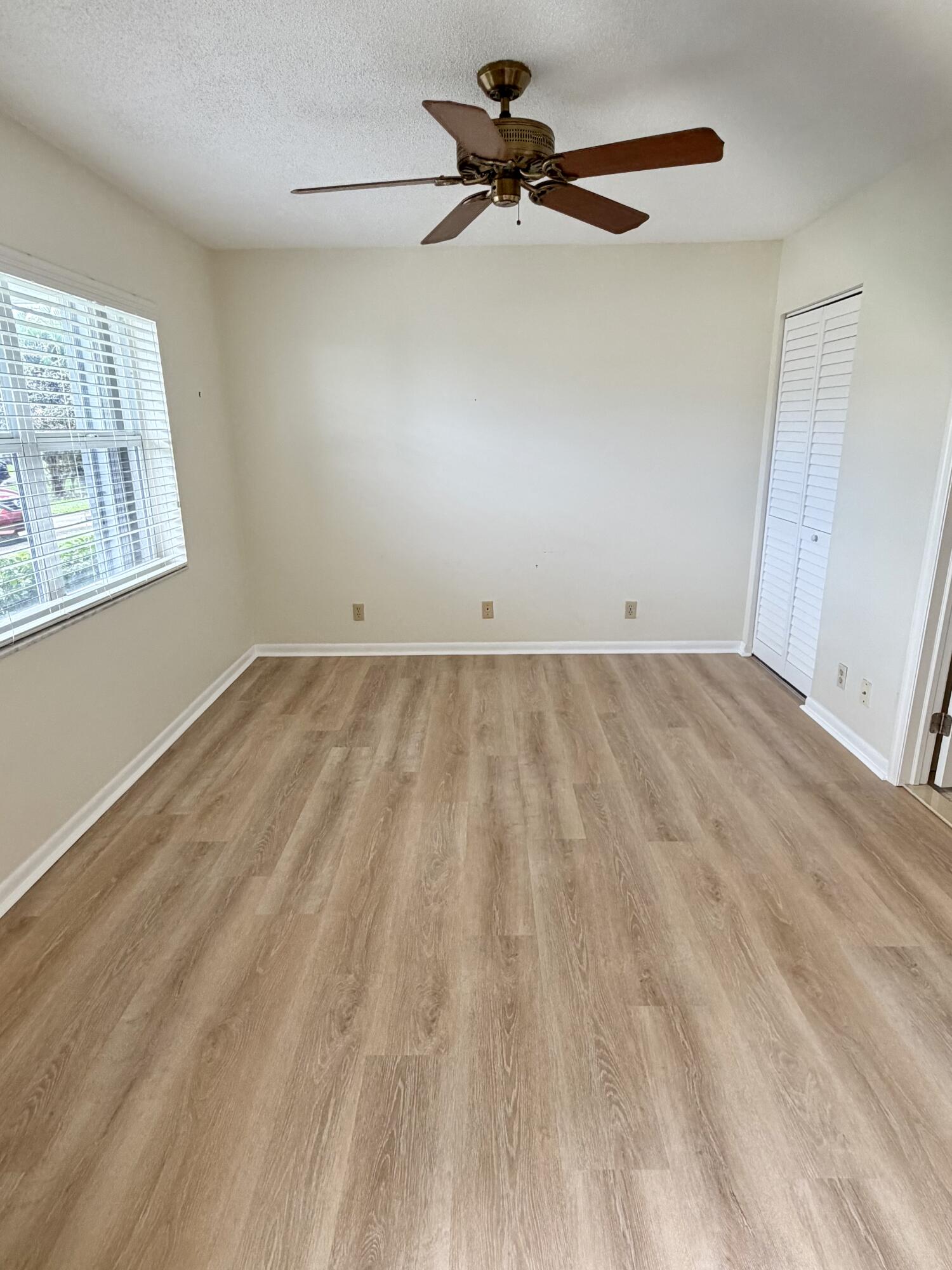 2840 Southwest 13th Street, Unit 103 Delray Beach, FL 33445 - Photo 33 of 72 a view of an empty room with a window