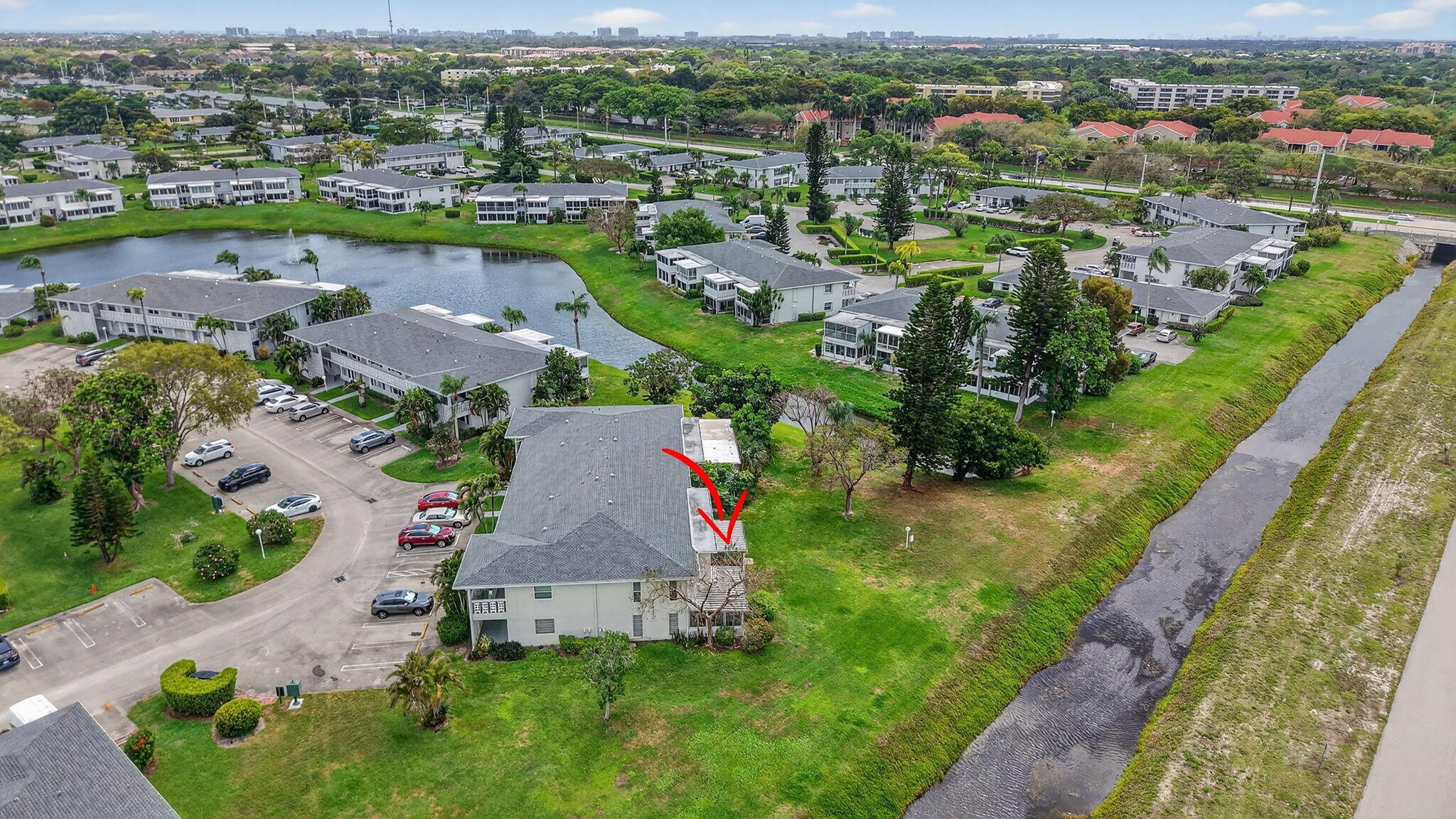 2840 Southwest 13th Street, Unit 103 Delray Beach, FL 33445 - Photo 48 of 72 an aerial view of residential houses with outdoor space and river