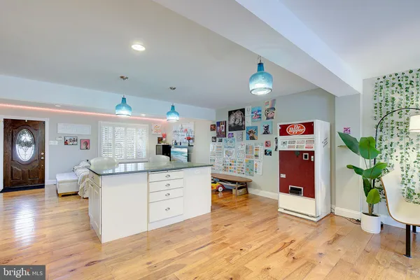 a living room with furniture a window and a flat screen tv