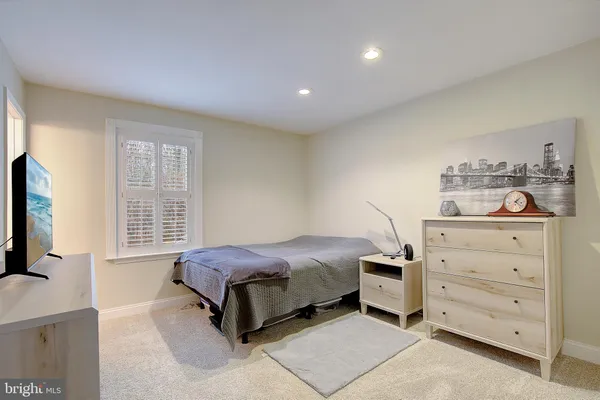 a bedroom with a bed and a cabinets