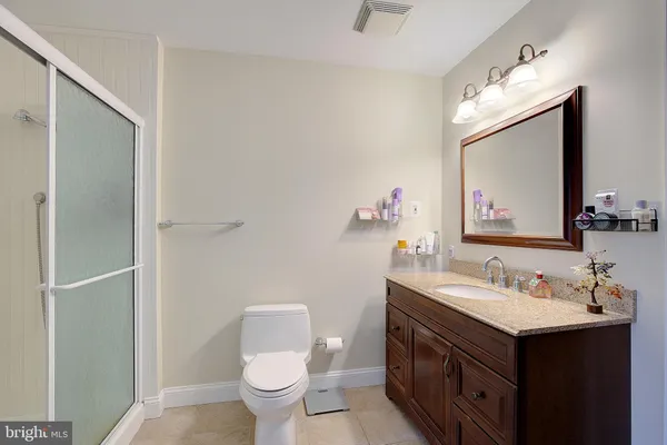 a bedroom with bed and window