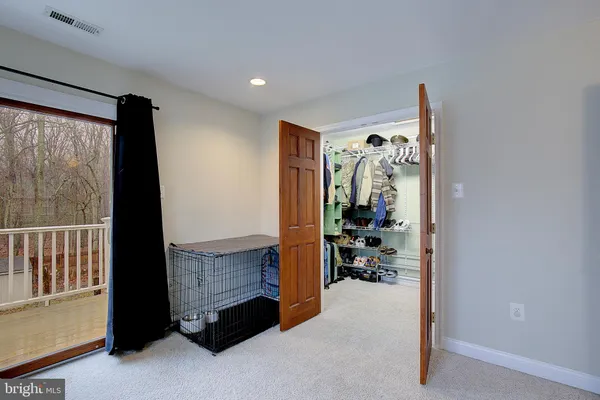 an aerial view of residential houses with outdoor space and swimming pool