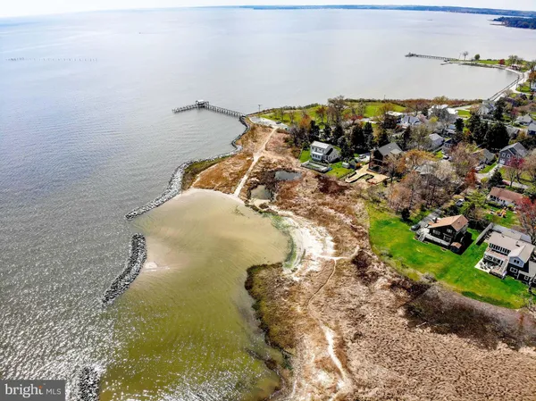 a view of a swimming pool with a yard