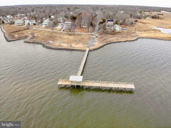 an aerial view of a house with a lake view