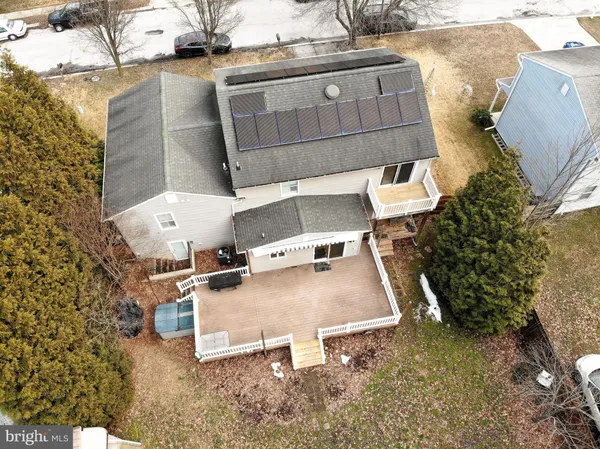 a view of a patio with table and chairs with wooden fence