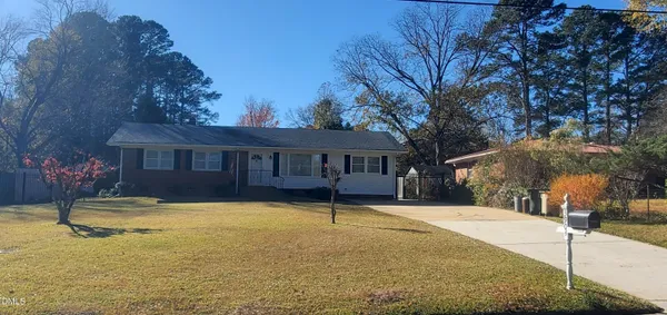a house with trees in front of it