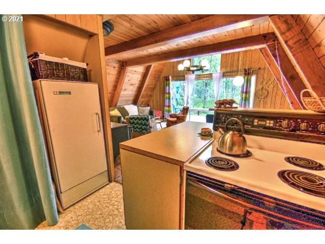 75893 East Road 28 Rhododendron, OR 97049 - Photo 11 of 28 a view of a kitchen with a stove top oven