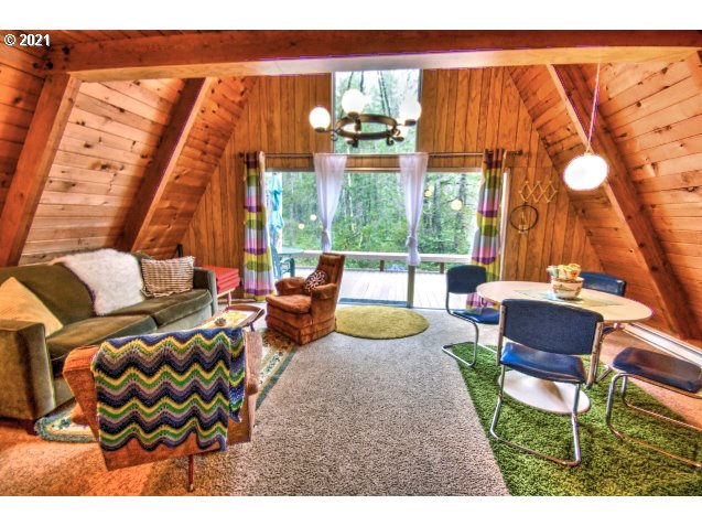 75893 East Road 28 Rhododendron, OR 97049 - Photo 3 of 28 a outdoor space with patio the couches and a potted plant