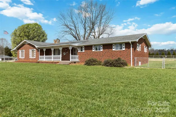front view of a house with a big yard
