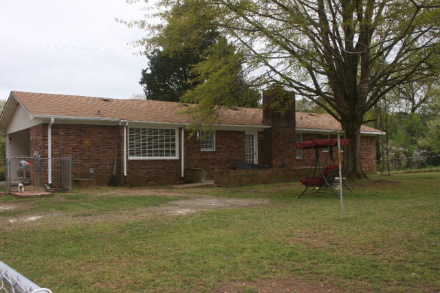 2735 Bonner Gilbert Road Lizella, GA 31052 - Photo 8 of 25 a backyard of a house with barbeque oven