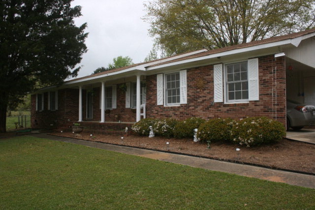 2735 Bonner Gilbert Road Lizella, GA 31052 - Photo 9 of 25 a front view of a house with yard and green space