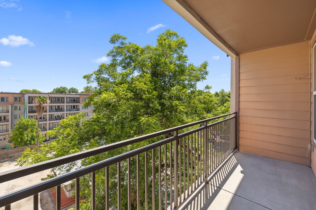 1900 Barton Springs Road, Unit 5009 Austin, TX 78704 - Photo 14 of 35 Enjoy tranquil views of lush trees and blue skies from this elevated private balcony.