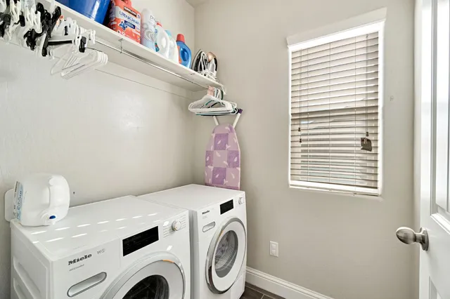 a utility room with dryer and washer