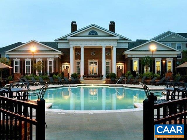 2555 Avemore Pond Road Charlottesville, VA 22911 - Photo 13 of 14 a front view of a house with swimming pool table and chairs