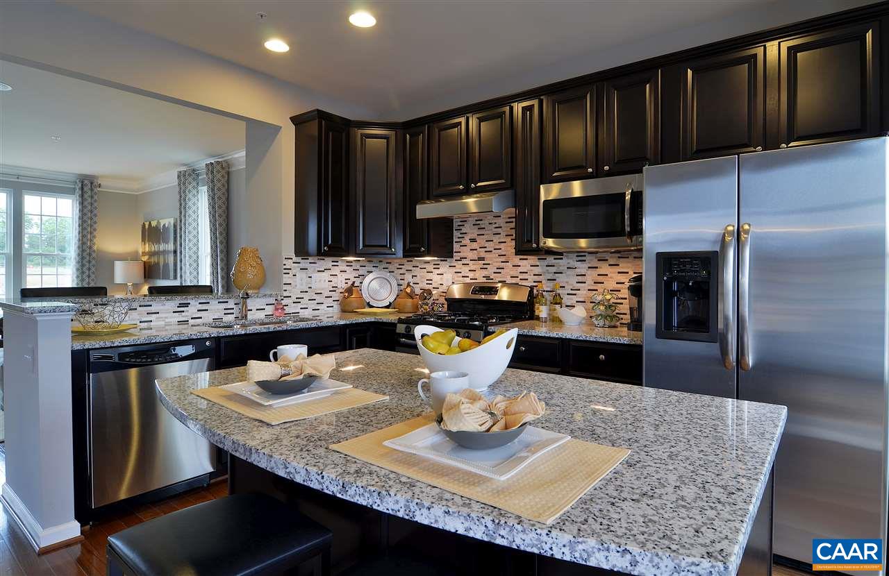 2555 Avemore Pond Road Charlottesville, VA 22911 - Photo 3 of 14 a kitchen with a table and chairs in it