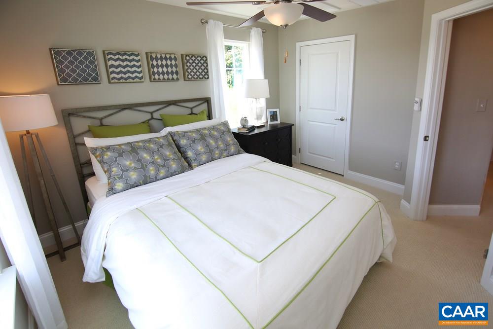 2555 Avemore Pond Road Charlottesville, VA 22911 - Photo 7 of 14 a bed sitting in a bedroom next to a window