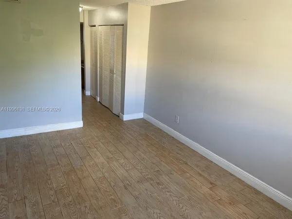 a view of gallery with wooden floor