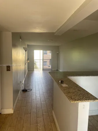 wooden floor with a faucet