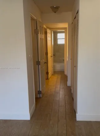 a white toilet sitting next to a window