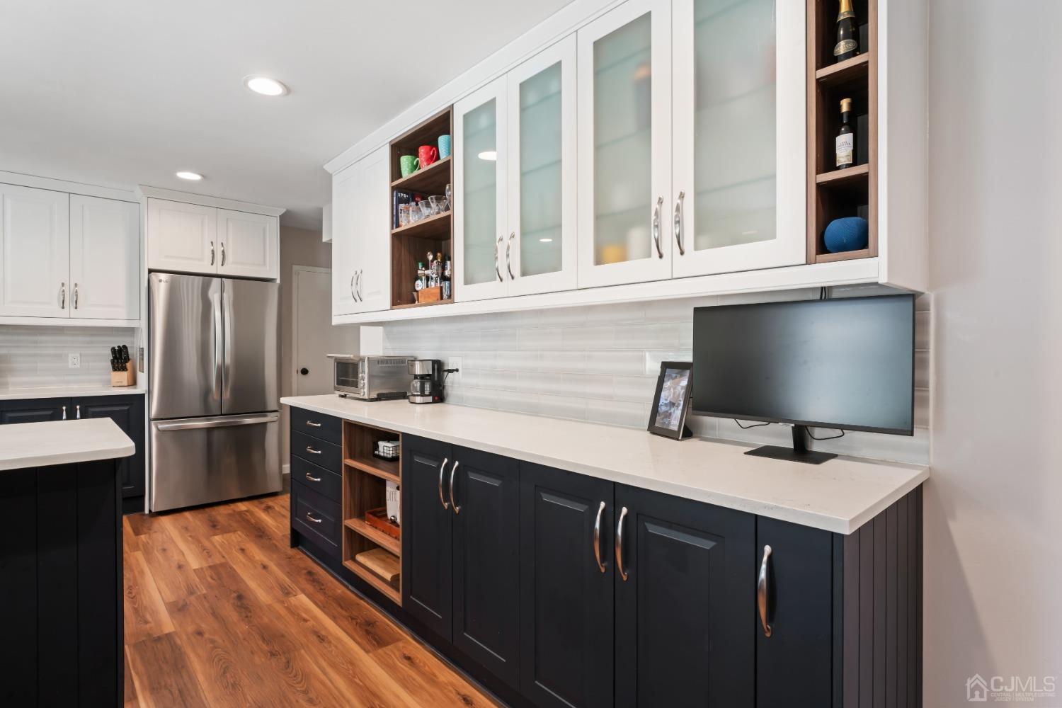 296 Colfax Road North Brunswick, NJ 08902 - Photo 11 of 37 a kitchen with stainless steel appliances a refrigerator sink and cabinets