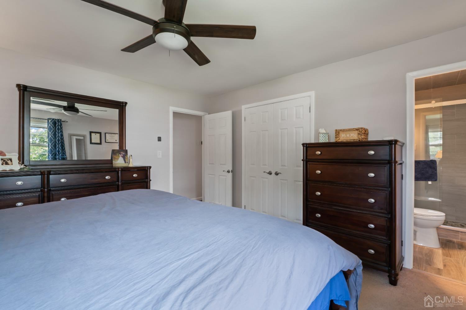 296 Colfax Road North Brunswick, NJ 08902 - Photo 21 of 37 a bedroom with a bed and a dresser