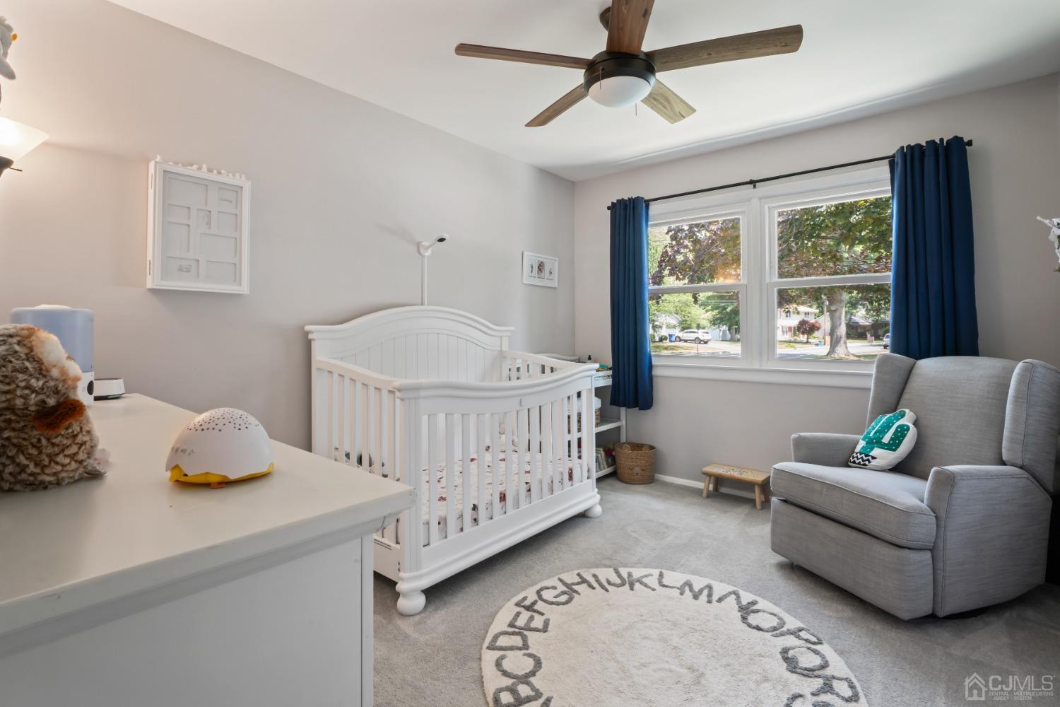 296 Colfax Road North Brunswick, NJ 08902 - Photo 23 of 37 a bedroom with a bed and wooden floor