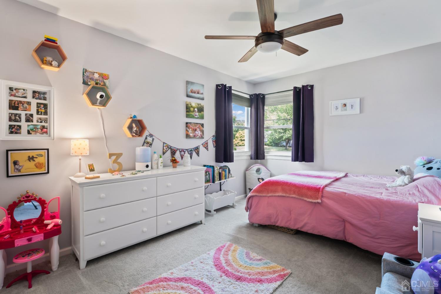 296 Colfax Road North Brunswick, NJ 08902 - Photo 25 of 37 a bedroom with a bed and a chandelier