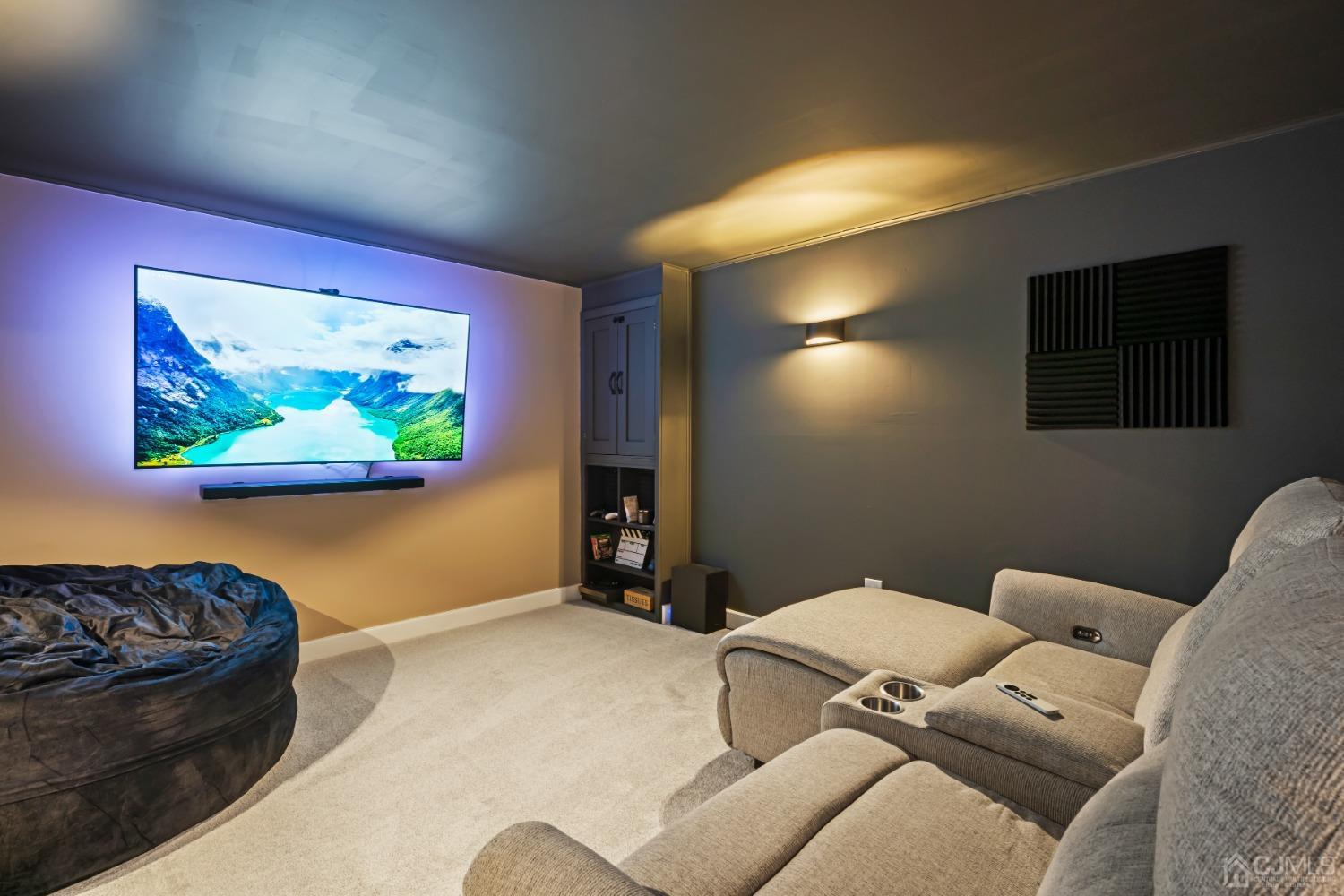 296 Colfax Road North Brunswick, NJ 08902 - Photo 28 of 37 a living room with furniture and a flat screen tv