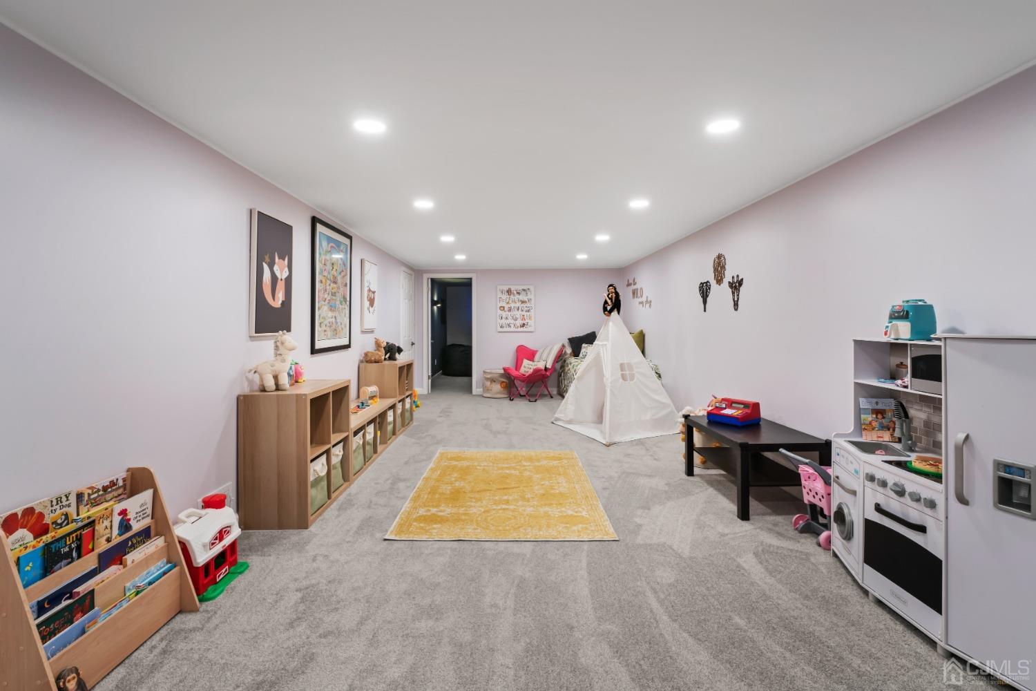 296 Colfax Road North Brunswick, NJ 08902 - Photo 29 of 37 a living room with furniture and a flat screen tv