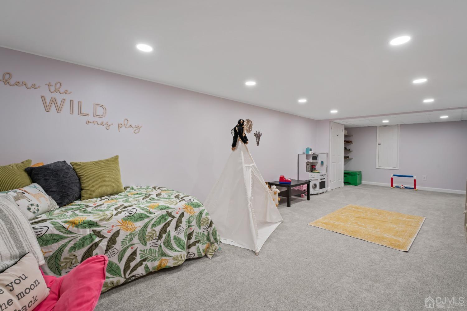 296 Colfax Road North Brunswick, NJ 08902 - Photo 30 of 37 a bed room with a bed and a chair