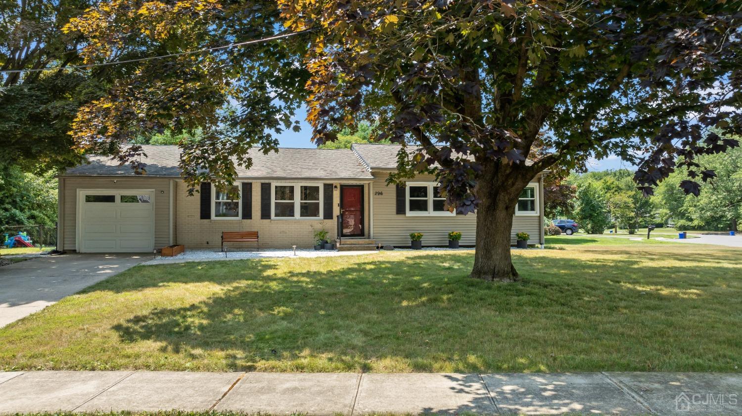 296 Colfax Road North Brunswick, NJ 08902 - Photo 3 of 37 a front view of a house with a garden