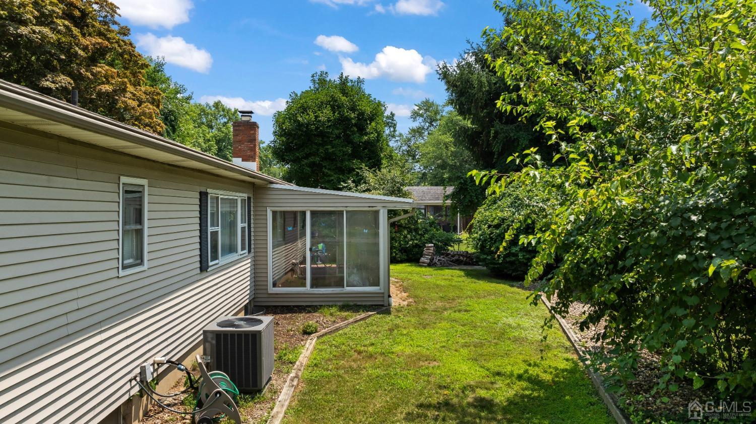 296 Colfax Road North Brunswick, NJ 08902 - Photo 33 of 37 a view of house with backyard space and garden
