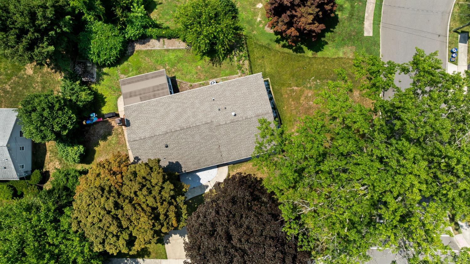 296 Colfax Road North Brunswick, NJ 08902 - Photo 4 of 37 an aerial view of a house with a yard lake and trees all around