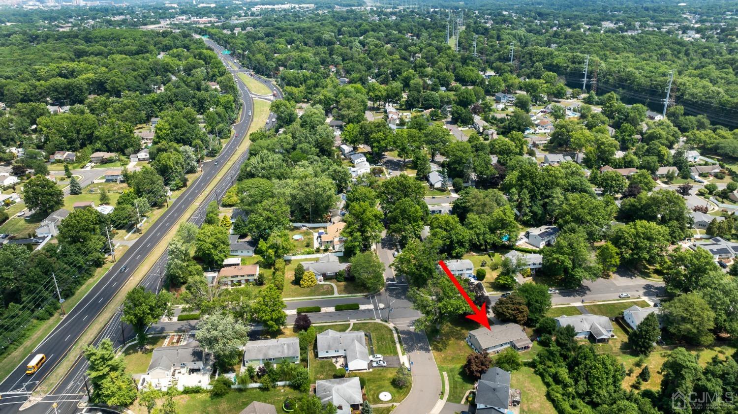 296 Colfax Road North Brunswick, NJ 08902 - Photo 6 of 37 a view of a city with lush green forest