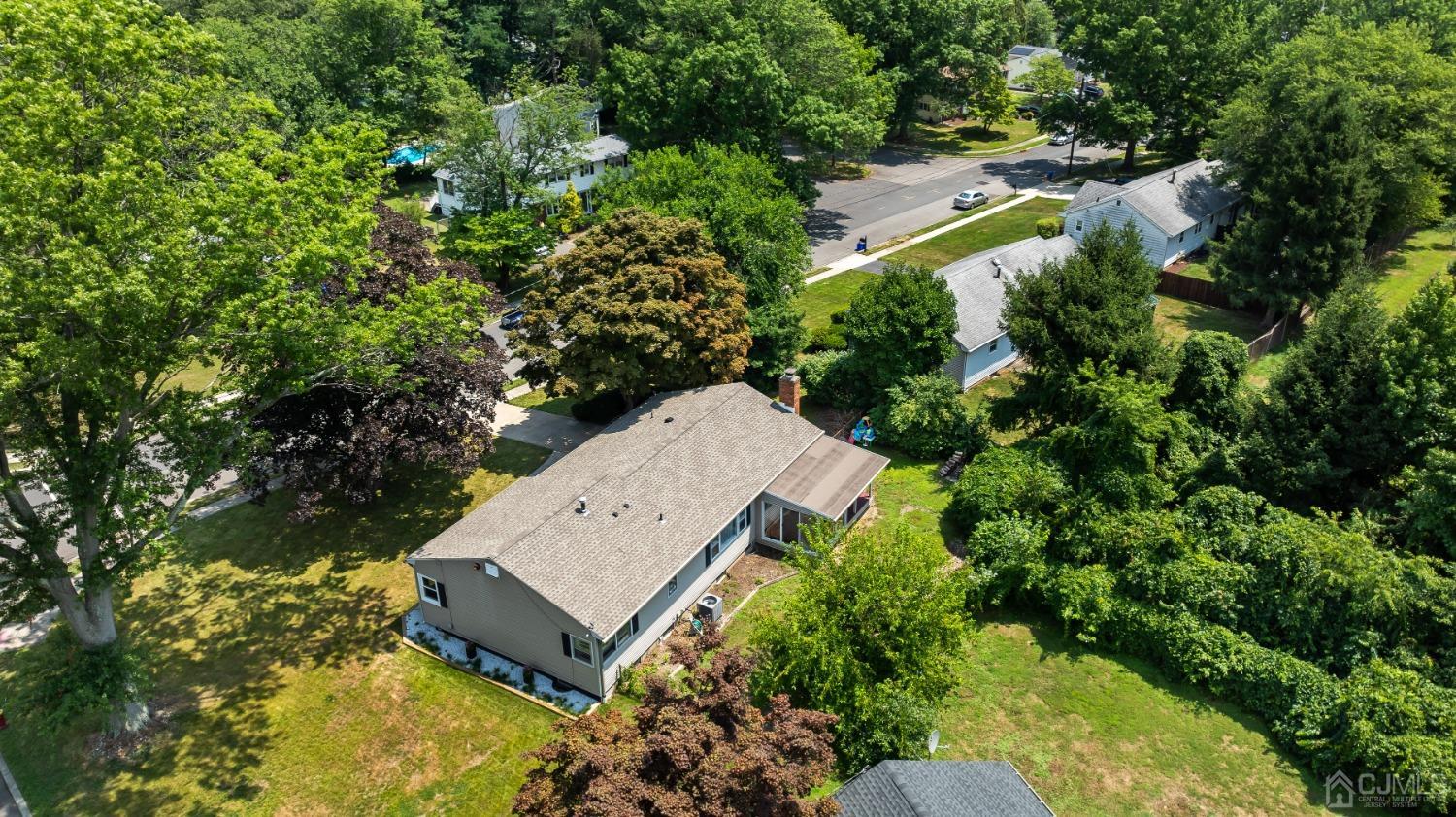 296 Colfax Road North Brunswick, NJ 08902 - Photo 7 of 37 an aerial view of a house with a yard basket ball court and outdoor seating
