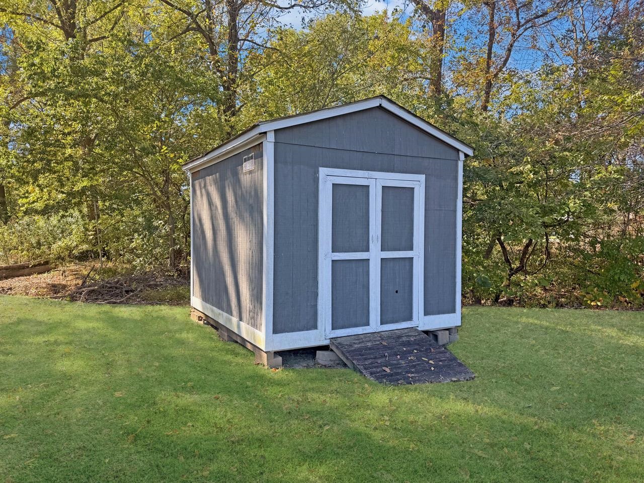 45 Village Avenue Ripley, TN 38063 - Photo 11 of 11 View of shed featuring view of wooded area
