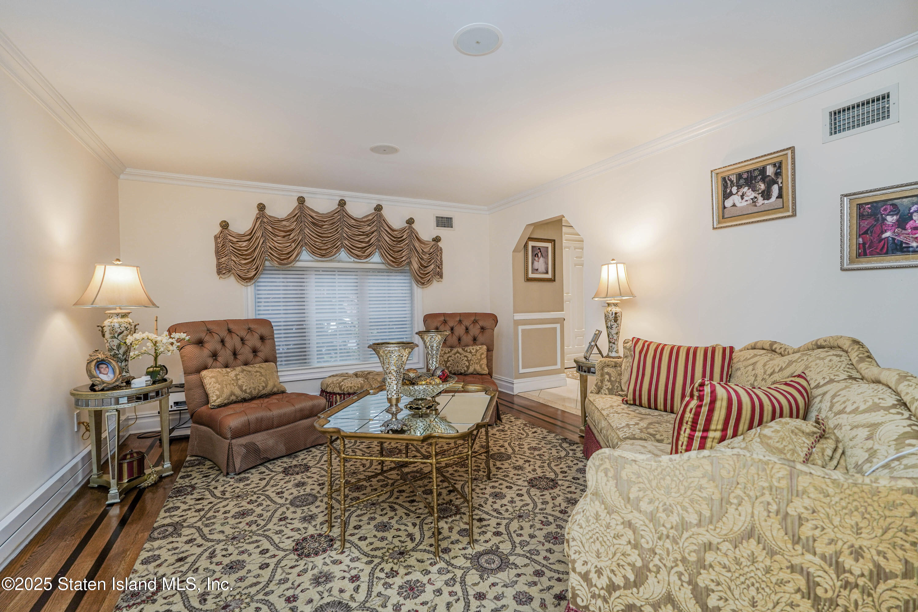 62 Ruxton Avenue Staten Island, NY 10312 - Photo 13 of 71 a living room with furniture and wooden floor