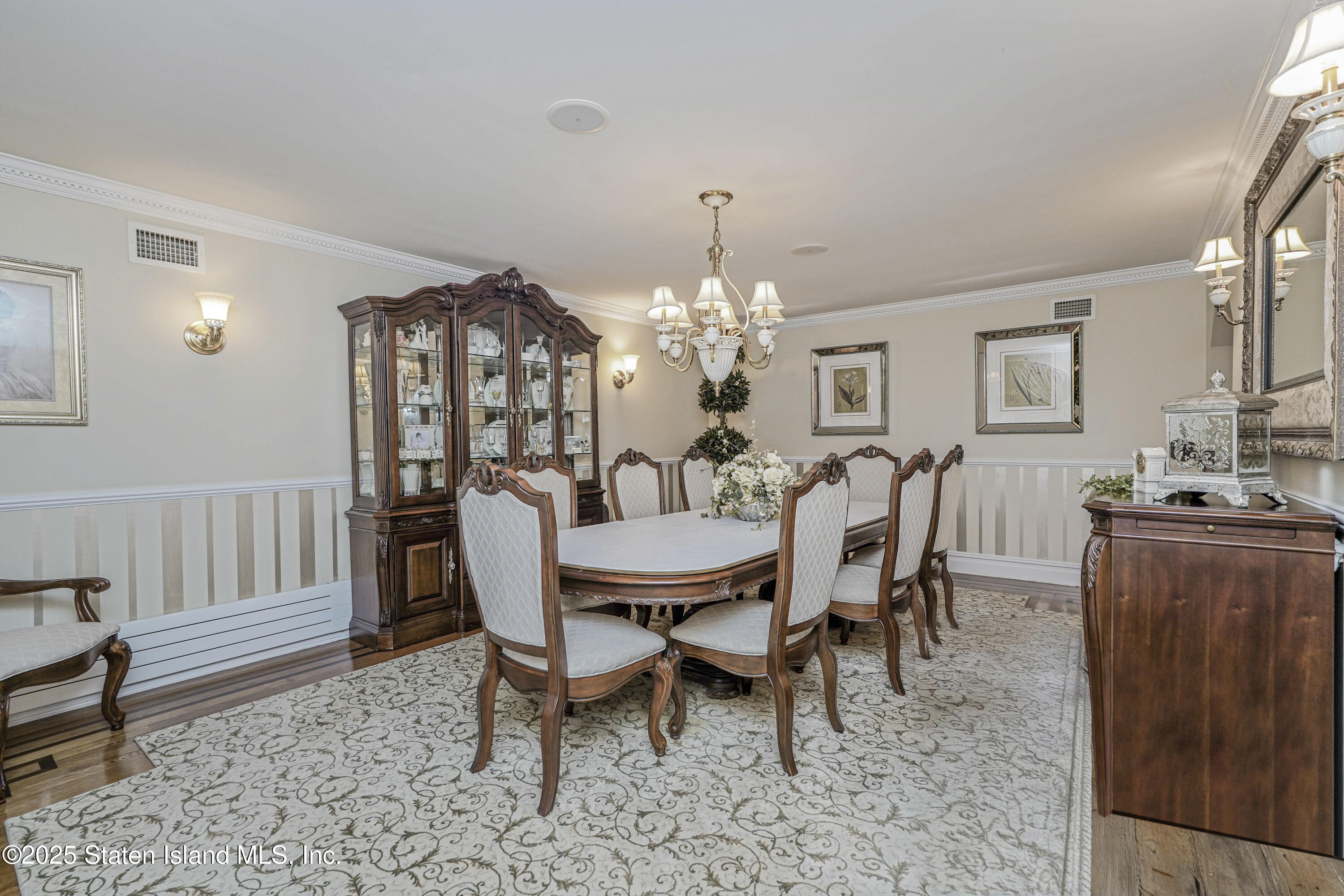 62 Ruxton Avenue Staten Island, NY 10312 - Photo 14 of 71 a view of a dining room with furniture and chandelier