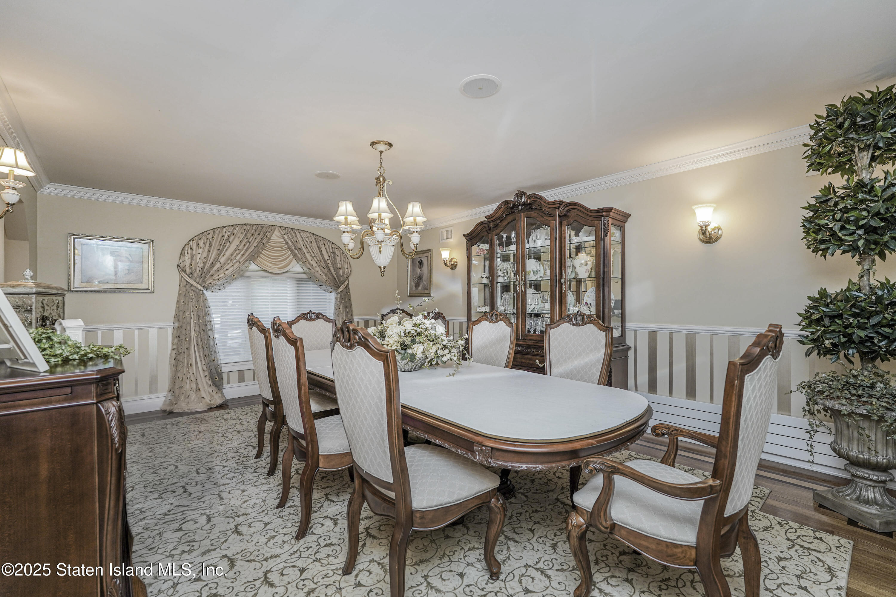 62 Ruxton Avenue Staten Island, NY 10312 - Photo 15 of 71 a view of a dining room with furniture and chandelier